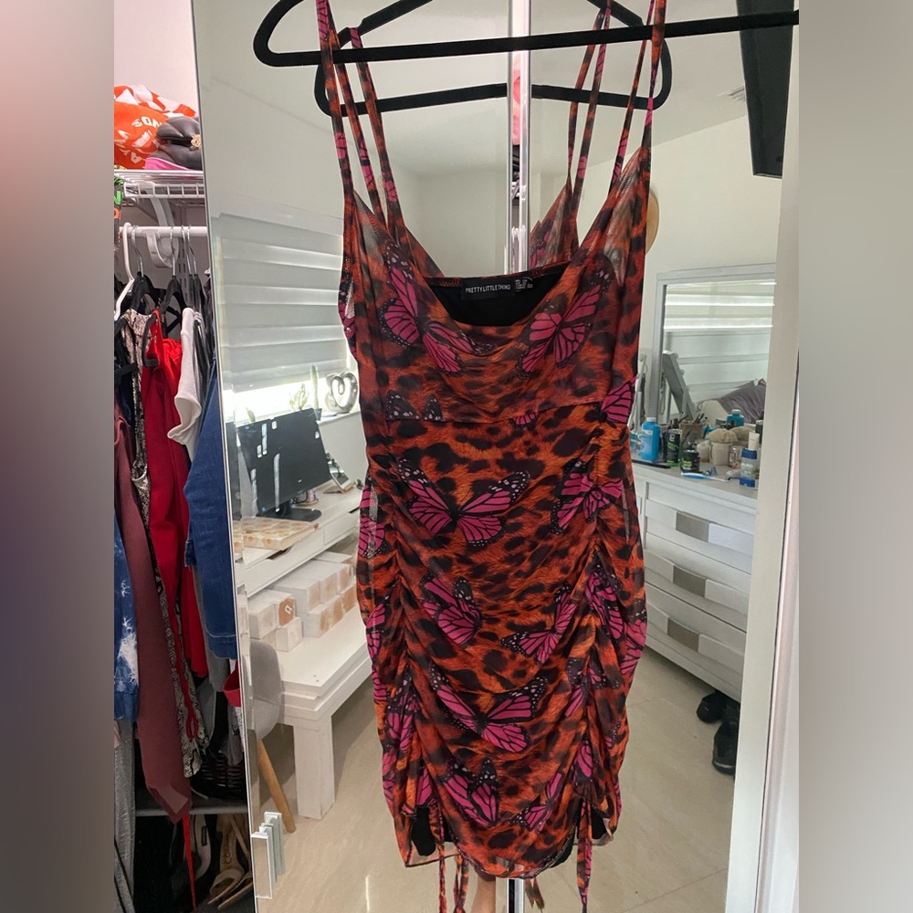 Us size 6 strappy ruched tie hem bodycon dress. Butterfly leopard print